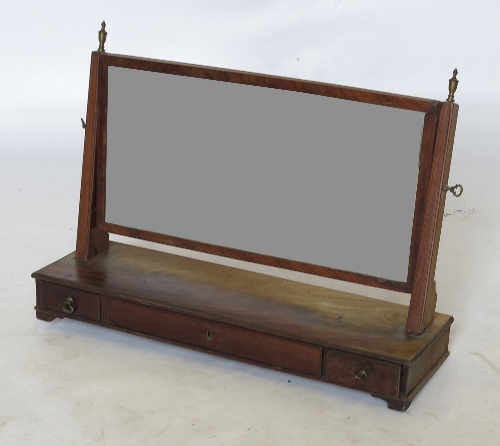 A 19th century mahogany swing frame toilet mirror, of rectangular form fitted with a frieze drawer,