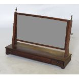 A 19th century mahogany swing frame toilet mirror, of rectangular form fitted with a frieze drawer,