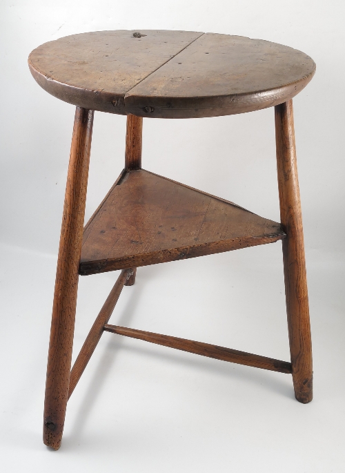 A 19th century country cricket table, possibly sycamore, with thick top,