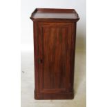 A 19th century mahogany pot cupboard, with fielded panelled door below the tray top,