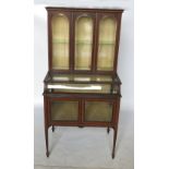 An Edwardian mahogany display cabinet, with boxwood line inlay and satinwood cross banding,