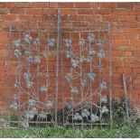 A pair of wrought iron gates, decorated with trailing vine, widths 29.75ins and 28.