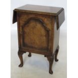 A small walnut pot cupboard, with cross banded drop flap top, fitted with a cupboard below,