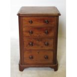 A 19th century mahogany bedside cupboard, fitted four graduated long drawers, with turned handles,