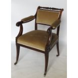 A mahogany armchair, with open scroll part padded arms, padded back and seat,