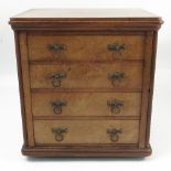 A 19th century miniature walnut chest of drawers, fitted with four long drawers,