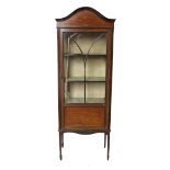 A 19th century mahogany display cabinet, with astragal glazed door opening to reveal shelves,