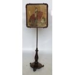 A 19th century pole screen, with rectangular tapestry panel,