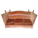 A Knoll style drop end sofa, in pink upholstery,