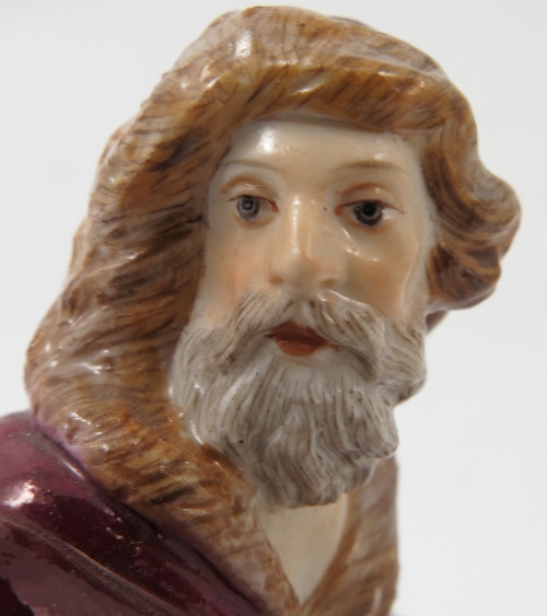 A Meissen figure, emblematic of Winter, of a bearded man wearing a fur lined clock by a fire, - Image 5 of 16