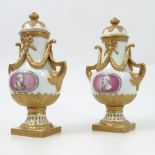 A pair of Meissen porcelain covered vases, the pierced covers decorated with gilt leaves,