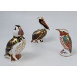 Three Royal Crown Derby paperweights, modelled as a puffin, a pelican and a kingfisher,