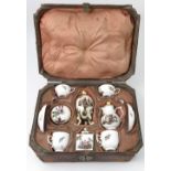 An 18th century Meissen porcelain travelling set, comprising two tea cups, two coffee cups,