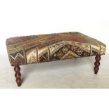 A rectangular stool, upholstered in the Kelim style, trade only,