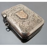 A silver and 9ct gold vesta case, Birmingham 1903, engraved with leaf scrolls,