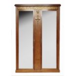 A Continental burr wood double mirror door wardrobe, with gilt metal mounts, to a Greek key frieze,