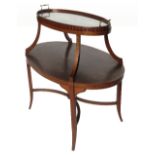 A 19th century mahogany oval two tier etergere, with marquetry inlay of mandolin, sheet music,