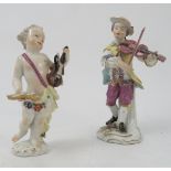 A 19th century Continental porcelain figure, of a man playing a violin,
