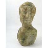 A 20th century terracotta bust, of a female with her head turned,