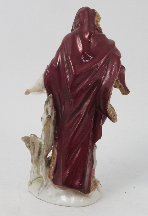 A Meissen figure, emblematic of Winter, of a bearded man wearing a fur lined clock by a fire, - Image 3 of 16
