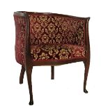 A late Edwardian mahogany framed tub chair,