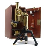 A J Swift & Son London brass and lacquered monocular microscope, with various lenses,
