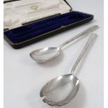 A boxed set of silver salad servers, with cylindrical handles and slip top ends, Sheffield 1909,