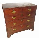 A Georgian mahogany straight front chest, of two short drawers over three long drawers,