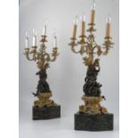 A pair of 19th century bronze and ormolu five light lamps,