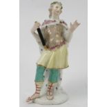 An 18th century Meissen figure, of a standing male figure, wearing an ermine lined cloak,