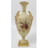 A Royal Worcester blush ivory vase, of baluster form, with mask handles,