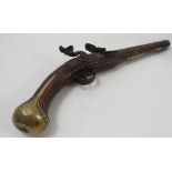 An Antique flint lock pistol, with brass and mahogany stock,