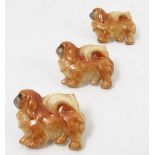 Three Royal Worcester brooches of Pekingese dogs, stamped Peke to the back, width 1.