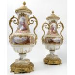 A pair of porcelain and ormolu covered vases,