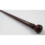 A Georgian elm customs stick, of tapering octagonal form, with knop end and brass tip,