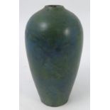 A 20th century art pottery vase, decorated in a mottled green and blue glaze, height 7.