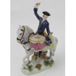A 20th century Meissen model, of a drum horse, man seated upon a horse plating two drums,