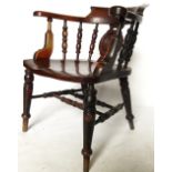 A late 19th century Windsor captains chair, with circular moulded bell push panel to the back,