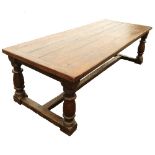 A reproduction oak refectory table, of rectangular form,