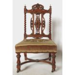 A 19th century walnut nursing chair, with ornate pierced and carved back,