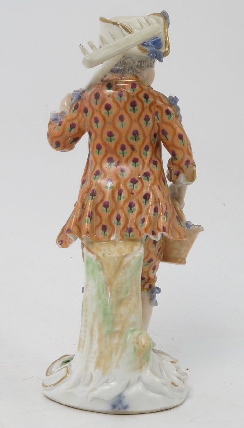 A Meissen figure, emblematic of Winter, of a bearded man wearing a fur lined clock by a fire, - Image 10 of 16