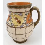 A Crown Ducal Charlotte Rhead jug, with tube lined decoration of a band of leaves and berries,