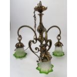 A brass Art Nouveau light fitting, the multi knopped column with flower petal decoration,