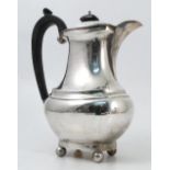 A silver coffee pot, with gadrooned edge and ball feet, Birmingham 1923,