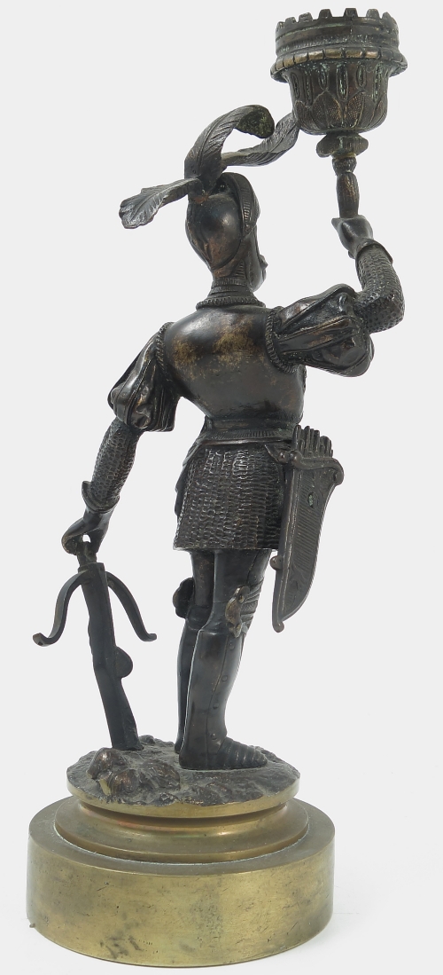 A 19th century bronzed candlestick, formed as a soldier in armour holding the sconce, - Image 2 of 3