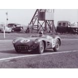 Nine black and white photographs, of Aston Martins, to include Jack Bradham, Jim Clark,