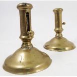 A pair of 19th century brass candlesticks, with ejector slide to the column,