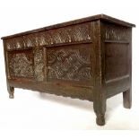 A late 17th century coffer, with plain rising panelled lid carved 1677 HH,