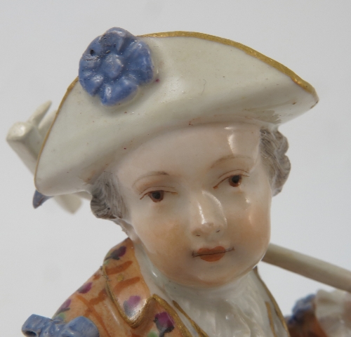 A Meissen figure, emblematic of Winter, of a bearded man wearing a fur lined clock by a fire, - Image 12 of 16