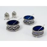 A pair of silver salts, of circular form with pierced decoration,